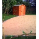 sand play area and wooden storage shed