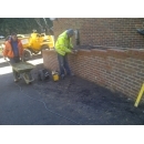 brick retaining wall being built