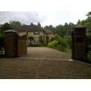 automated gates opening to a detached home