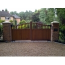 automated gates shut outside a detached home