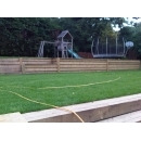 timber retaining wall around children's play area