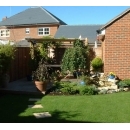 lush garden and paving leading to pergola